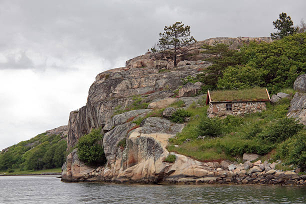 istock Hillside stone cottage in archipelago 177305483