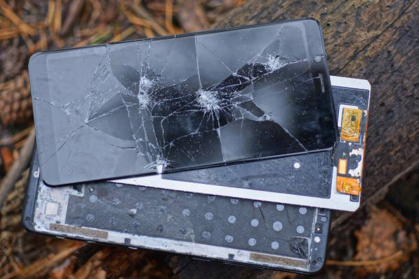 istock three pieces of an old disassembled smartphone with a broken black screen in cracks 1773061645