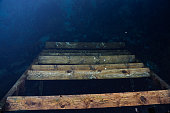 steps under water. The staircase below is hidden under the water. Lake emptied the stairs. Reflection. deeply drowned down