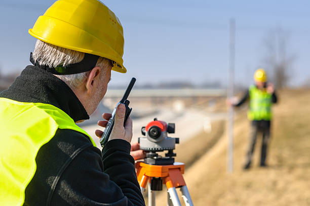 istock Two surveyors in reflective gear and tools outdoors 177307001