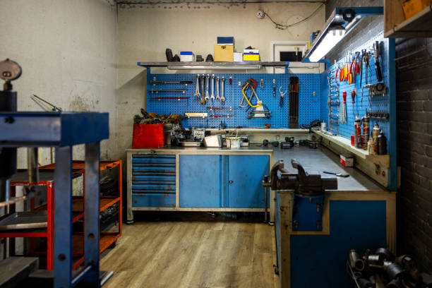 Work tools hanging on wall at workshop