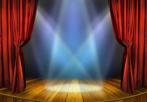 Theater stage Theater stage with red curtains and spotlights.Theatrical scene in the light of searchlights, the interior of the old theater. orchestra photos stock pictures, royalty-free photos & images