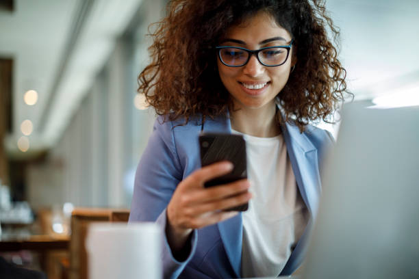 istock Smiling businesswoman working at hotel cafe 1773071976