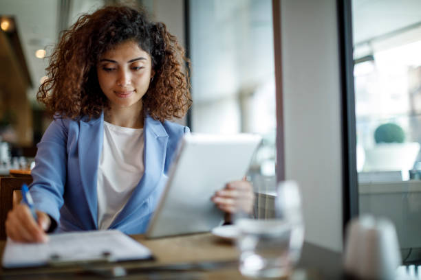 istock Businesswoman working at hotel cafe 1773071985