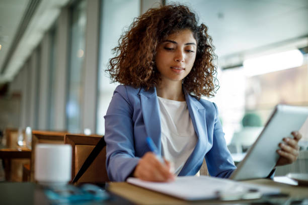 istock Businesswoman working at hotel cafe 1773071986