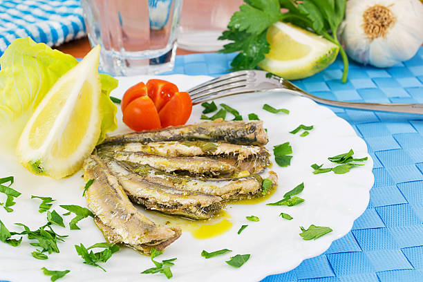 istock Marinated anchovies in the dish with lemon 177307730
