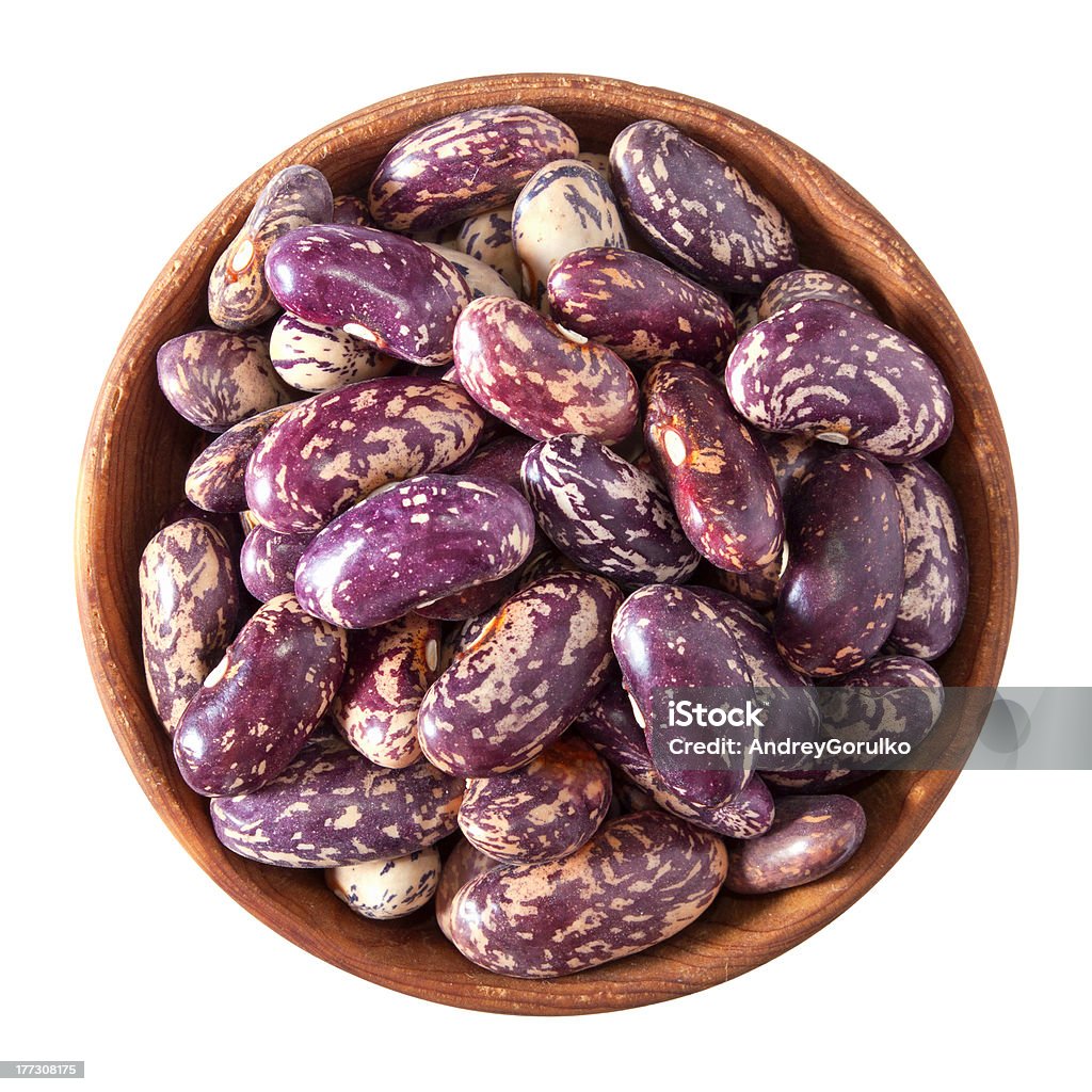 wooden bowl full of speckled beans isolated on white wooden bowl full of speckled beans isolated on white background Bean Stock Photo