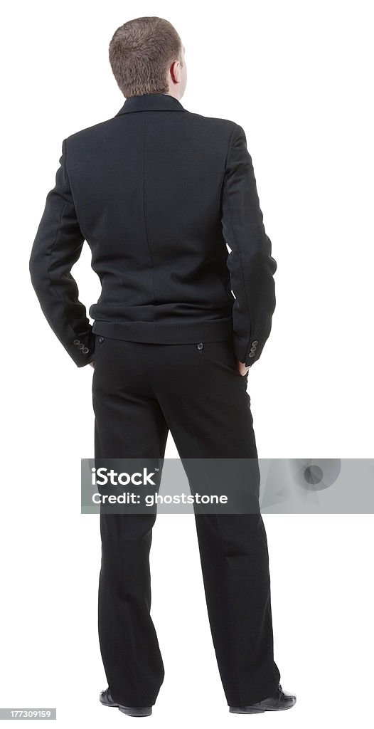 Vista posterior de adulto hombre en traje negro de mira. - Foto de stock de Adulto libre de derechos