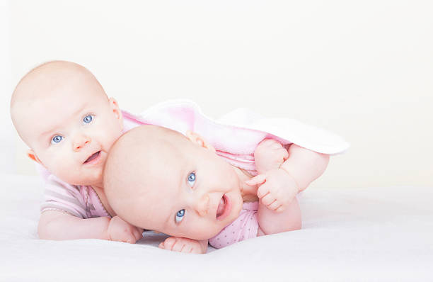 istock identical baby twin sisters 177309166