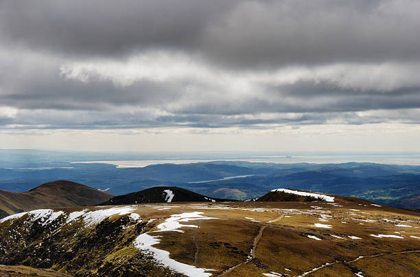 istock Snow still lines the edges of hills. 177309351