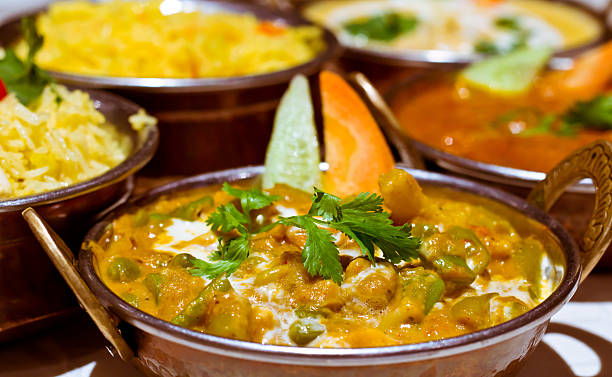 istock Indian curry and rice selection in copper balti dishes 177309721