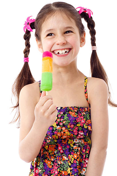 Girl with water ice cream "Happy girl with water ice cream, isolated on white" flavored ice photos stock pictures, royalty-free photos & images
