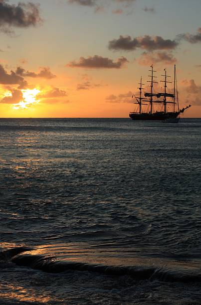 istock Caribbean sunset and silhouett of the ship 177310065