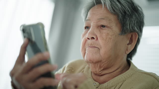 Senior woman using smartphone.
