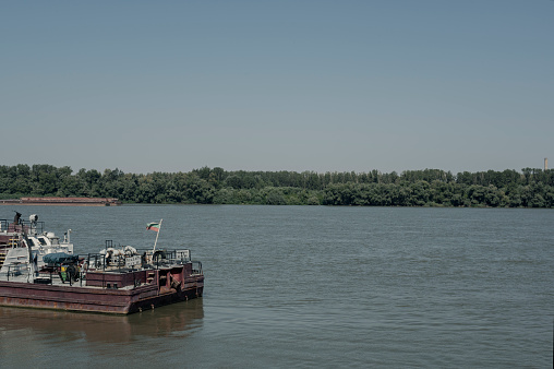 Ships passing Düsseldorf on the river Rhine with an exceptional low water level during a long period of drought in the summer of 2022.
