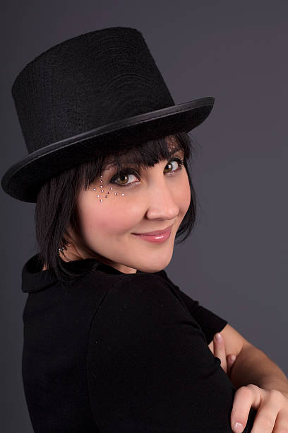 istock Beautiful young woman with a black fedora hat 177312285