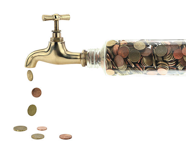 Money concept of a faucet full of change, pouring money out  http://www.microstock.gr/istock/financial.jpg cent sign photos stock pictures, royalty-free photos & images