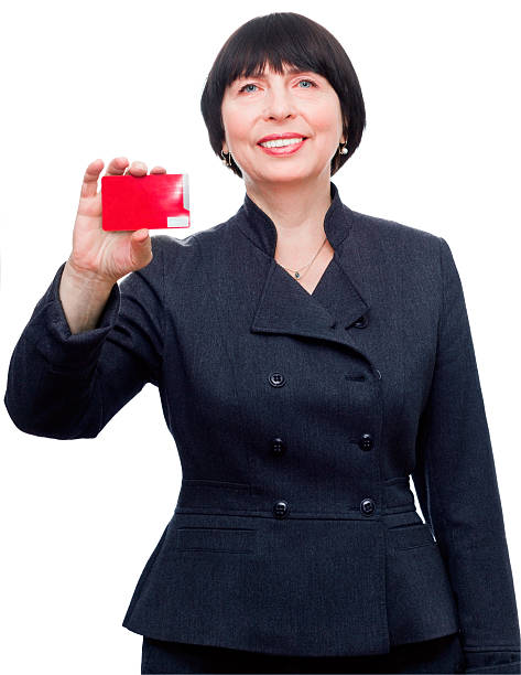 Confident business woman with credit card stock photo