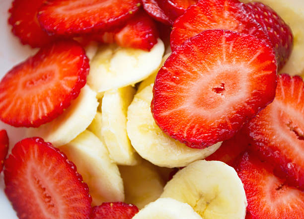 Banana and strawberry slices stock photo