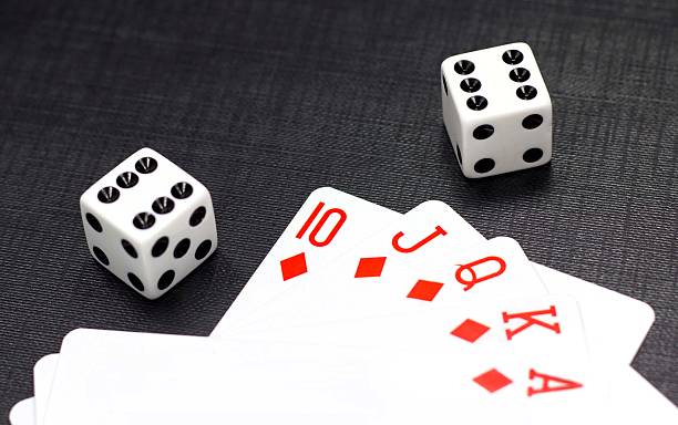 istock Dices and playing cards on a black background 177313631