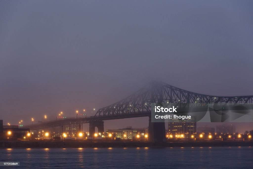 Jacques Cartier Bridge, Montreal "MontrAal, QuAbec, Canada - May 1st, 2012: Long shot on the Pont Jacques-Cartier under fog, viewed from the  le Sainte-HAlAne, looking north." Bridge - Built Structure Stock Photo