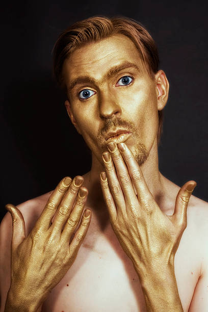 istock men with bronze makeup on her face and hands 177314018