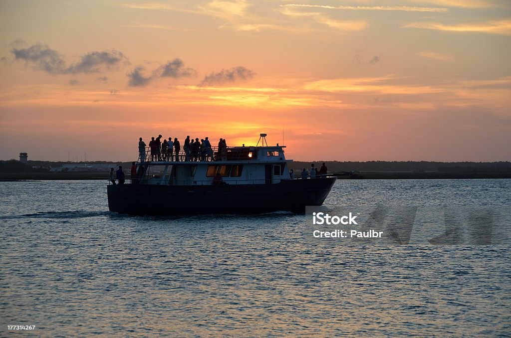 Sunset Cruise "People silhouetted on a sunset cruise on the Tolomoto River, St. Augustine, Florida, USA." Florida - US State Stock Photo