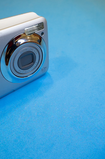 15-Year-Old Digital Camera on a Blue Background