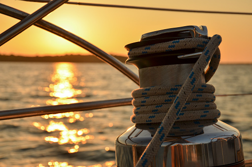 Mooring rings close-up with tied mooring line. View of the bay and marina of Marmaris. Turkey