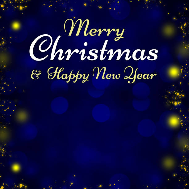 Christmas background in blue tones with defocused sparkling lights. Merry Christmas and Happy Yew Year text. Space for copy.
