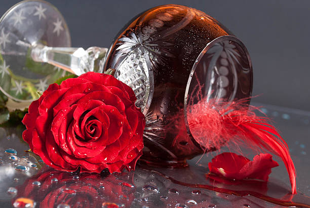 Red rose and spilled wine stock photo