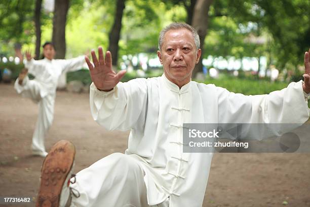 Old Asian Man Doing Tai Chi Outside Stock Photo - Download Image Now - Kung Fu, Asian and Indian Ethnicities, East Asian Culture