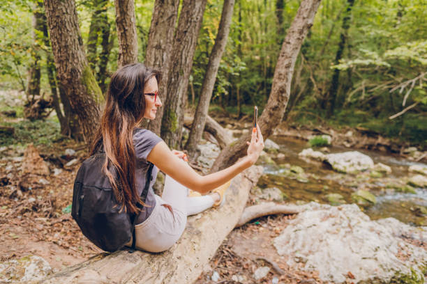 istock A young woman takes a selfie in forest 1773166285