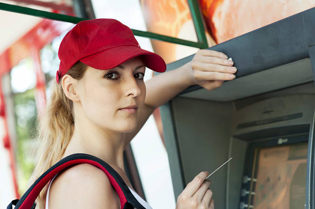 istock woman and ATM machine 177317032