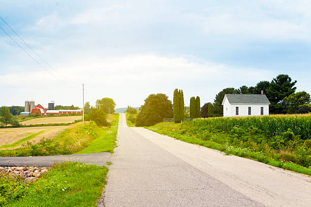 istock Country Road With Red Farm and Church 177317455