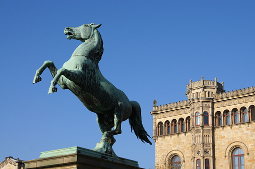 bronze statue of the Saxon Steed in front of the university building in Hanover, Germany