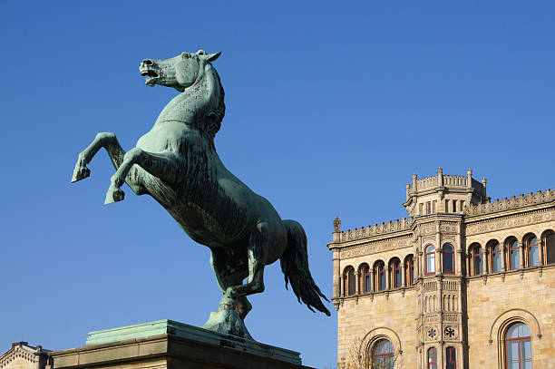 Saxon Steed bronze statue of the Saxon Steed in front of the university building in Hanover, Germany lower saxony stock pictures, royalty-free photos & images