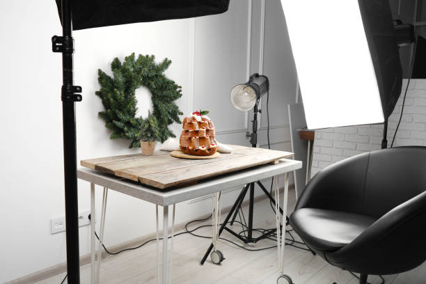istock Professional equipment and Christmas composition with Pandoro cake on wooden table in studio. Food photography 1773179048