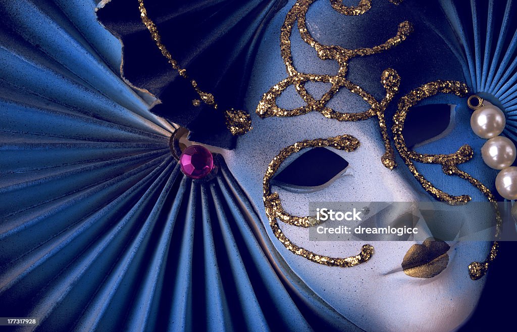 Blue Venetian mask A traditional and decorative blue mask with gold and pearls Carnival - Celebration Event Stock Photo