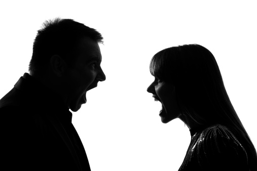one caucasian couple man and woman face to face screaming shouting dispute in studio silhouette on white background