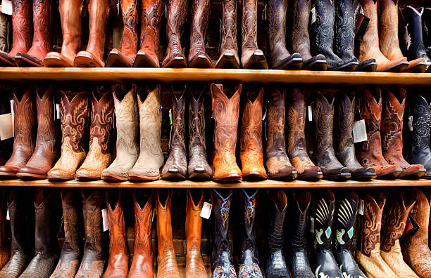 Wall of Cowboy Boots Wall of cowboy boots in a country western store cowboy boot stock pictures, royalty-free photos & images