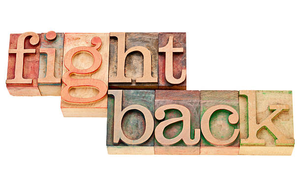 istock fight back - motivation concept in wood type 177318796