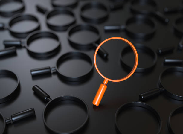 istock Orange Metallic Magnifier Symbols on Black Background 1773193282