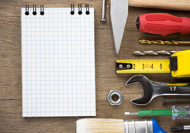 istock set of tools and notebook on wood 177319579