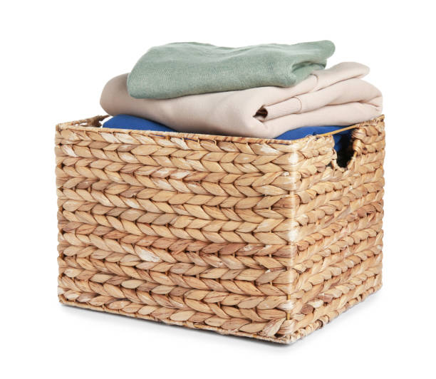 istock Wicker laundry basket with clean clothes isolated on white 1773200148