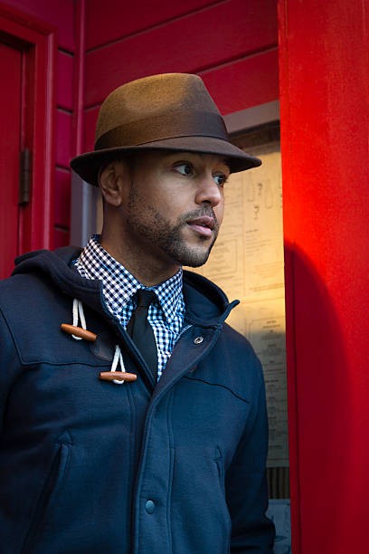 istock Young Black Man with Fedora in Red Doorway 177320053