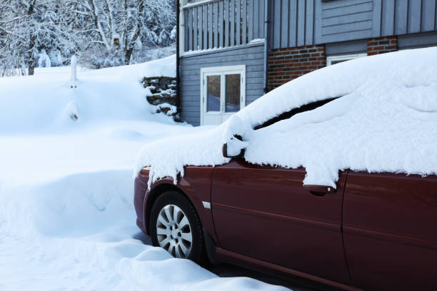 istock Modern car covered with snow near building on winter day 1773200714