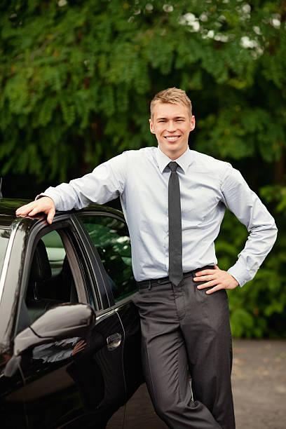 istock Businessman standing next to his car 177320325