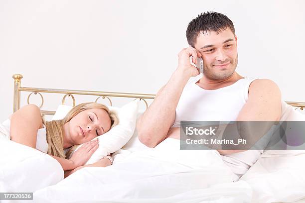 Man Cheating While Woman Sleeping Stock Photo - Download Image Now - 20-29 Years, 30-39 Years, Adult