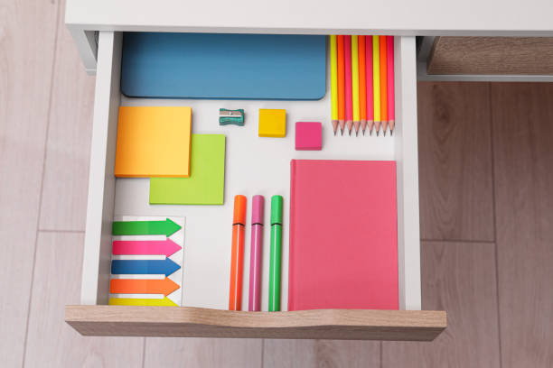 istock Office supplies in open desk drawer, above view 1773212819
